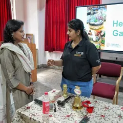Our founder, Saloni Kumar, discussing the art of terrarium making with a faculty member at Ramaiah University. We tailor our workshops to be both educational and engaging for students and staff alike.