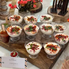 Dahi Bhalla served in individual glasses, a modern twist on a classic chaat. The presentation is both elegant and convenient for guests at a festive Rakhi gathering.