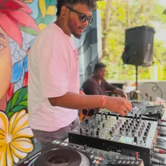 Mixing tracks at an outdoor Holi party in Davangere. I love daytime events where the sun is out and the colors are as vibrant as the electronic and pop music I'm playing.