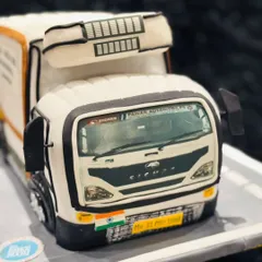 The front view of the Eicher truck cake, showcasing the detailed grille, windshield, and even the Indian flag. It's a perfect tribute, sculpted entirely from cake and fondant.