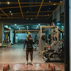 A full-body shot in the gym after a hard workout. This is the lean strength look we aim for: muscular, defined, and athletic.