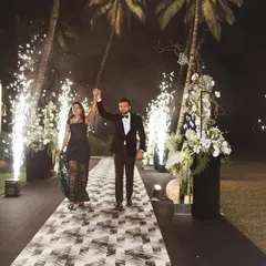 Their classy and elegant vibe shone brighter than the sky as they walked hand in hand. This entry was all about them, with a path lit by cold pyros creating a magical walkway.