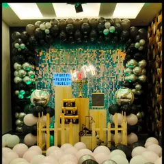 This setup is perfect for a stylish kitty party or any modern celebration. The black and silver balloon arch, combined with a "Hot Party" neon sign and disco ball accents, creates a cool and glamorous vibe.