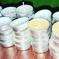 Stacks of my handmade tealights, showing how they are prepared for bulk orders. These are perfect for businesses like hotels and restaurants.