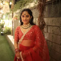This client looked absolutely gorgeous in a classic red lehenga for her sister's wedding. We styled her head to toe, and the final look with the traditional jewellery was simply stunning.