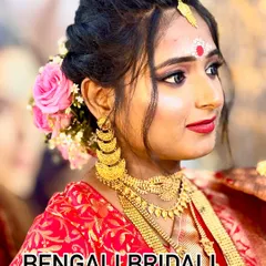I specialize in creating authentic regional bridal looks. Here is a beautiful Bengali bride, complete with the traditional bindi and chandan design, paired with classic eye makeup and a bold red lip.