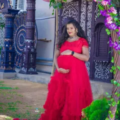 This outdoor location has such beautiful, ornate doors. The vibrant red gown creates a stunning contrast, making for a very grand portrait.