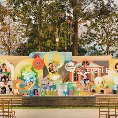 That's all, folks! A grand Looney Tunes first birthday celebration for Bhuvik. This expansive outdoor stage brings the classic cartoon to life with large cutouts of Bugs Bunny, Sylvester, Daffy Duck, and the whole gang, complete with colorful balloon art and themed houses.