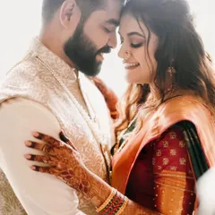 An intimate and tender moment from an engagement shoot. The traditional outfits and her intricate henna design add so much beauty to the photo.