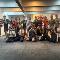 A full house for one of our training sessions. This large group photo captures the diverse community of kids, teens, men, and women who train with us.
