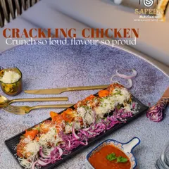 Our Crackling Chicken is a house favorite, known for its incredibly crunchy exterior and tender, juicy chicken inside. Served on a bed of crisp shredded cabbage and topped with grated cheese, it's a textural and flavorful starter perfect for any occasion.