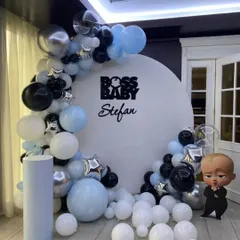 For a fun and stylish party, I can create character-themed decorations like this "Boss Baby" setup. It includes a personalized round backdrop, a modern black, blue, and silver balloon arch, and a life-sized character cutout for the perfect photo opportunity.
