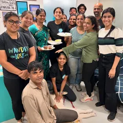 A moment of celebration with the team. These people are my rock, supporting me through personal health challenges while helping grow our business and care for the dogs.