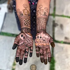 A fun and whimsical baby shower mehendi for Sanmita. The design includes cute cartoon elephants with thought bubbles, a baby sleeping in a cradle under a mosque, and a tiny footprint inside a heart.