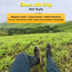 Shoes with grip, not style. On slippery trails, the right footwear is essential for safety. I always recommend proper trek shoes with deep grip.