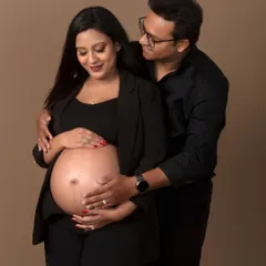 A chic and modern couple portrait. Dressed in all black, they pose together, creating a sophisticated and timeless image that focuses on their connection.