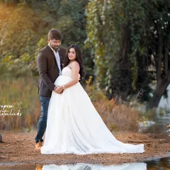 There's a special magic in capturing the connection between partners as they wait for their little one. This serene, lakeside portrait uses the soft, golden hour light to highlight their shared love and anticipation in a quiet, natural moment.