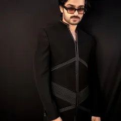 The 'Grooved Lines' jacket, another of my signature designs. This piece features structured, geometric lines on a sharp black Indo-Western silhouette for a modern and edgy look.
