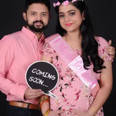 A "Coming Soon" announcement from a happy couple during their maternity shoot. I have a variety of props like this chalkboard sign to help you share your exciting news.