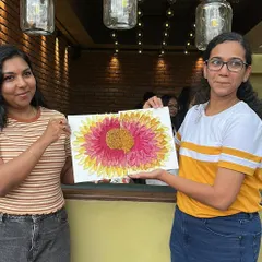 Two friends showing off their completed texture art piece. It’s amazing how different interpretations of the same subject can be.