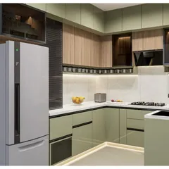 A 3D concept for a dual-tone kitchen combining sage green and natural wood. This render highlights the roller shutter appliance garage and the efficient L-shaped layout.