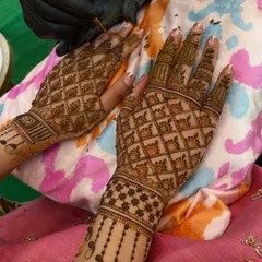 My team and I applying mehandi for the wedding guests. We ensure everyone gets a beautiful design to be a part of the celebration.
