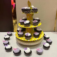 A beautiful tiered display of our butterfly cupcakes, perfect for a party dessert table.