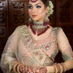 This bride is wearing a beautiful pastel pink lehenga. I used a soft smokey eye and a nude pink lip to create a sophisticated and modern bridal style.