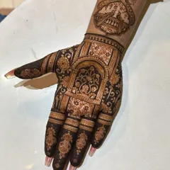 An architectural design inspired by Rajasthani palaces. The intricate arches and jaali work create a sense of grandeur, perfect for a bride who loves traditional art.