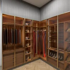 I designed this walk-in closet for a client in Palam Vihar, using a combination of glass and fluted PU finishes. The warm tones, integrated lighting, and chevron-patterned floor create a space that is both luxurious and highly functional.