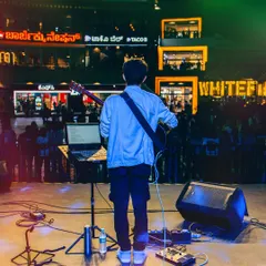 Performing for a lively crowd at Phoenix Market City, Bangalore. This is the kind of large, open-air venue where my band and I feel right at home, creating a festival atmosphere.