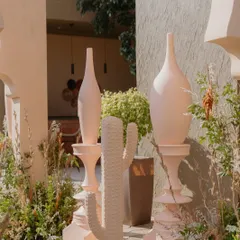 A close-up of the decor elements from the 'Desert Oasis' Haldi, showing the custom-made cacti and elegant vases that contributed to the unique and cohesive theme.