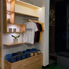 We keep our studio stocked with all the essentials. Here you can see our collection of yoga blocks and branded apparel, ready for our members.