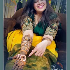 A candid shot of Ujala pointing to the details in her mehndi. We love it when our clients are as excited about the art as we are.