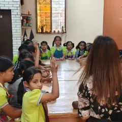 We love hosting school groups like these students from Gopal's Garden School. Here, an instructor engages with the children, answering their questions and giving them a hands-on introduction to the world of pottery.