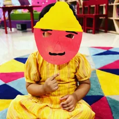 For Dussehra, we learned some fun facts about Ravana and then each child made their own mask. This little one is proudly showing off the ten headed mask he created.