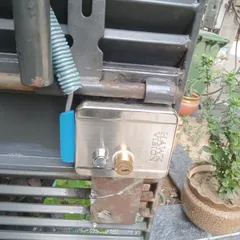 A duplicate image of the installed Hawkvision electronic lock, showing how it fits securely onto the client's main gate.