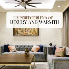 Here, we achieved a perfect blend of luxury and warmth. The plush, tufted grey sofa is paired with a simple wooden coffee table and gold accents, creating a space that is both elegant and inviting.