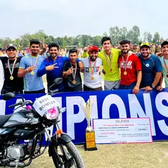 Victory at the 11th Police Martyrs Memorial Cricket Tournament. Our team celebrates with the championship banner and trophy, a result of discipline, teamwork, and superior skill honed at our academy.