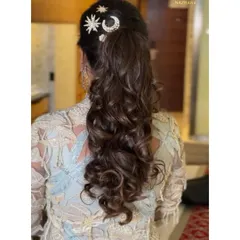 A detailed back view of the textured ponytail, showing off the quirky star and moon hair accessories.