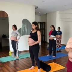 In a quiet moment, we pause. This is more than a pose; it's a conversation with the new life you are nurturing. I encourage you to connect with your body and your baby, feeling the profound changes happening within.