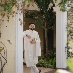 A classic, full-length portrait of the groom looking sharp and ready for his wedding at Sula Vineyards.
