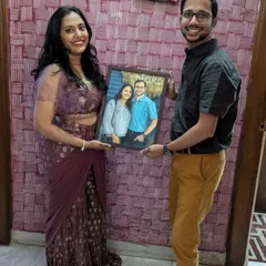 The beautiful couple posing with the portrait I painted for them as a birthday surprise. They look so happy.