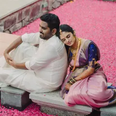 A moment of peaceful rest on a bed of flowers. This image combines traditional attire with a touch of modern romance, creating a serene and beautiful couple portrait.