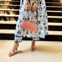 A closer look at how to style a modern kurta set. Pairing the outfit with pink block heels and a matching bag elevates the entire look, making it perfect for a semi-formal day event.