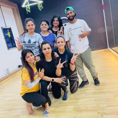 All smiles after a tough but rewarding fitness class with our instructor, Arun. The shared energy and support make every workout better.