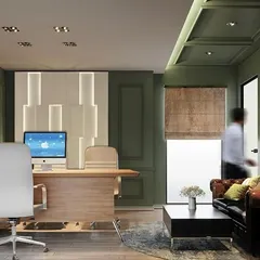 This director's office combines classic comfort with modern functionality. The design uses a soothing olive green on the paneled walls, a rich leather chesterfield sofa, and contemporary lighting to create a workspace that is both authoritative and inviting.