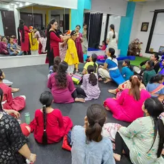 Another view of our costume and makeup workshop. Students gather around to learn from an expert, gaining practical skills that are essential for a performer.