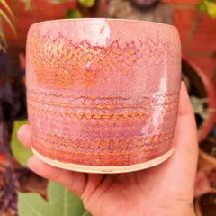 This pink tumbler has a lovely textured pattern from pressing lace into the clay. I am always inspired by the calm and serene statues in my studio.
