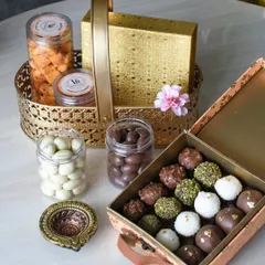 A luxurious Diwali gift set combining a golden basket of treats with a box of my signature assorted truffles. This hamper offers the best of both worlds, with a variety of textures and flavors.